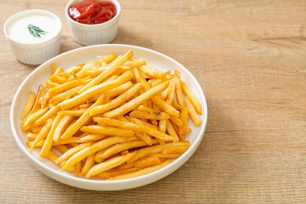 French fries or potato chips with sour cream and ketchup