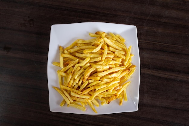 French fries on white dish