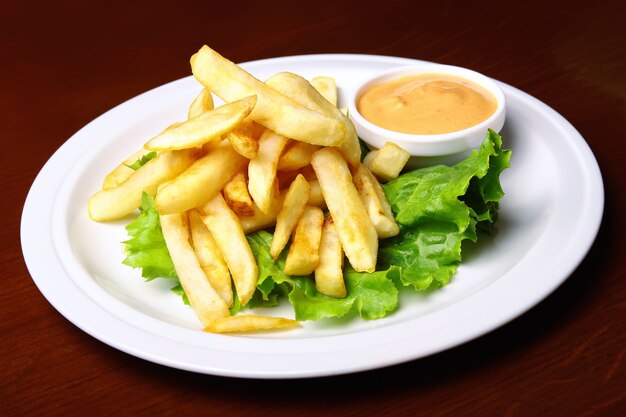 Photo french fries with sauce