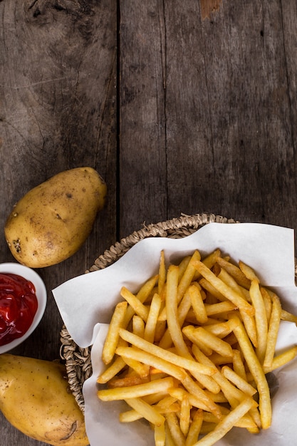 French fries on wooden table 