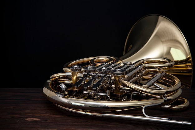 French horn on a wooden table