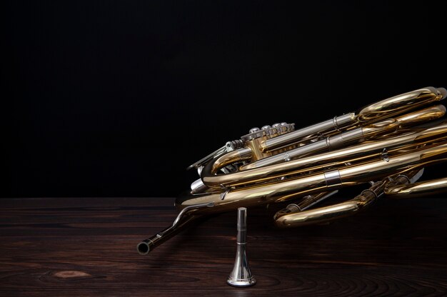 French horn on a wooden table