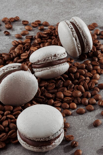 French macaroons isolated with coffee beans.