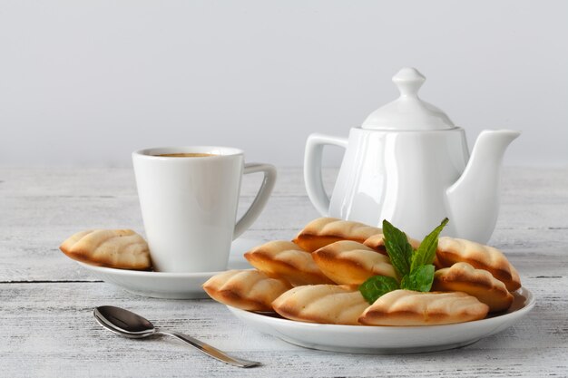 French madeleines with cup of coffee