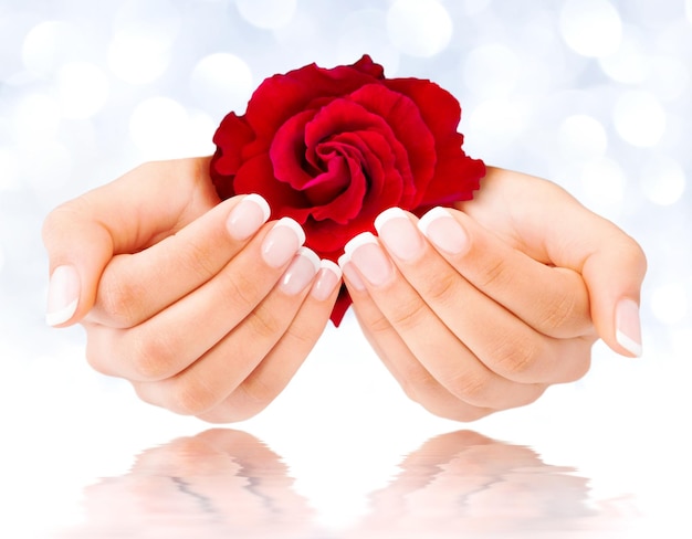 french manicure with red rose on water