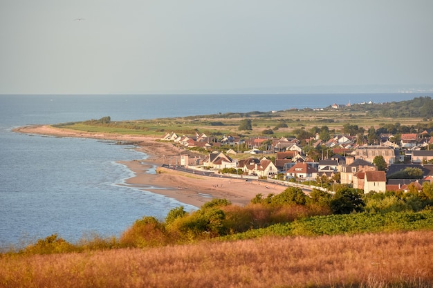 French Normandy coast village at sunset.