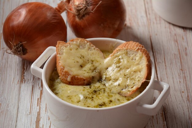 French Onion Soup with toasted bread and cheddar cheese