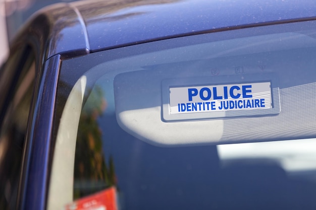 French Scientific police sign on a sun visor