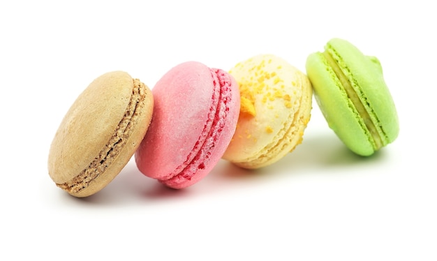 A french sweet delicacy, macaroons variety closeup. Macaroons on white background
