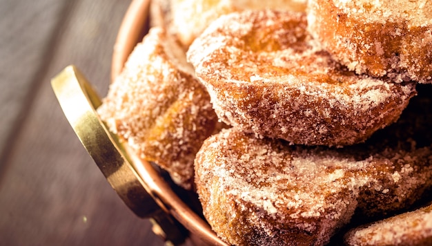 French toast, called "rabanada" typical Brazilian dessert for Christmas in copper pot. Christmas party concept, sweet New Year.