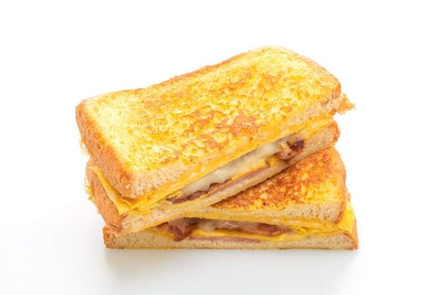 French toast ham bacon cheese sandwich with egg isolated on white background