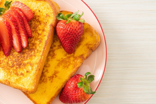 French toast with fresh strawberry on plate