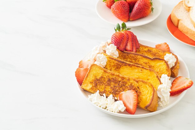 French toast with fresh strawberry and whipping cream