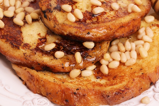 French toast with honey syrup croutons pine nuts breakfast sweet dessert selective soft focus