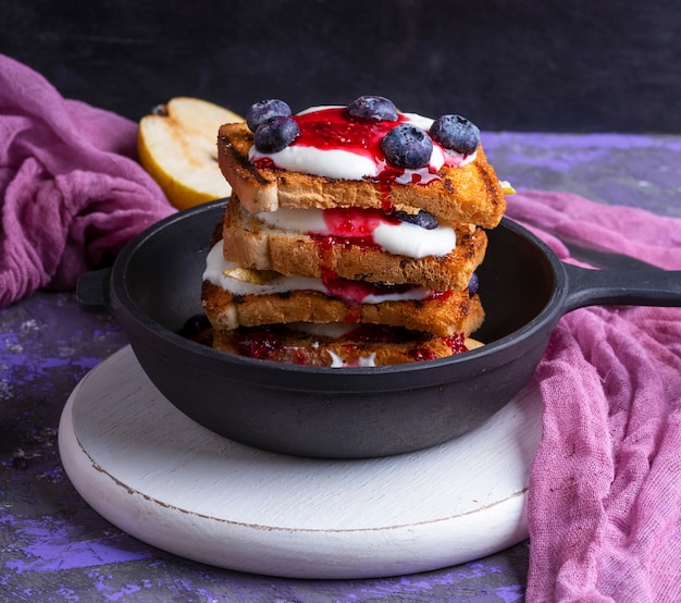 French toast with jam, sour cream and fruit 