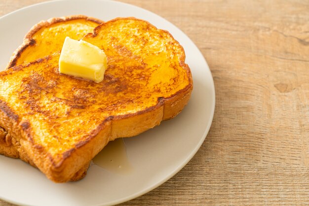 French toasted with butter and honey for breakfast