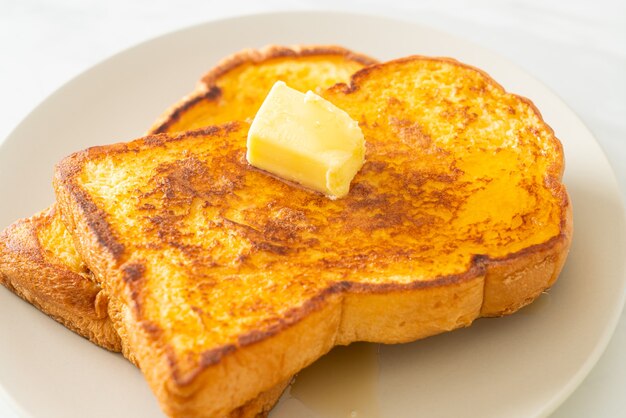 French toasted with butter and honey for breakfast