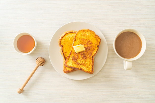 French toasted with butter and honey for breakfast