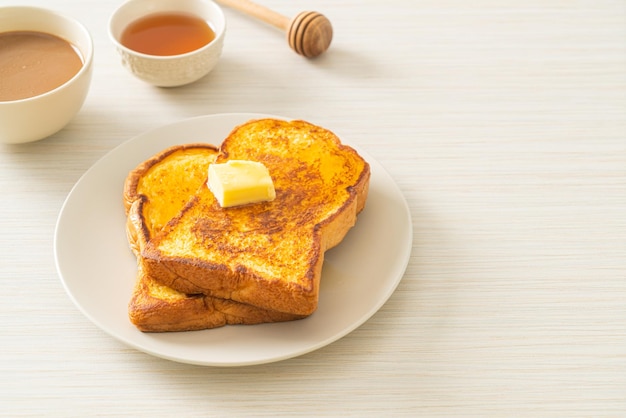 French toasted with butter and honey for breakfast