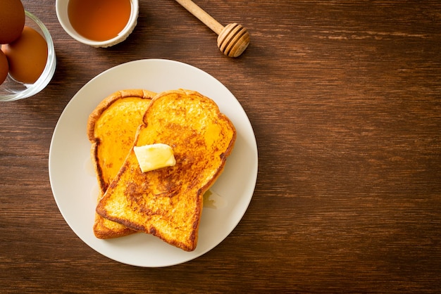 French toasted with butter and honey