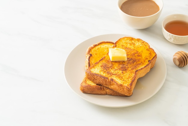 French toasted with butter and honey