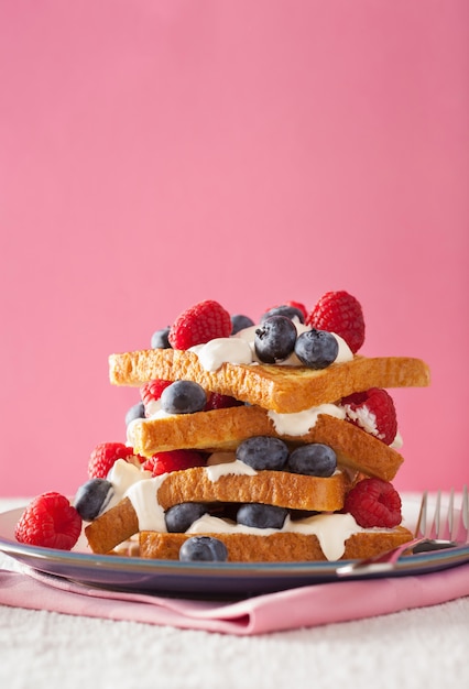 French toasts with creme fraiche and berries for breakfast