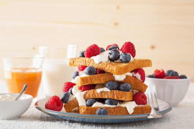 French toasts with creme fraiche and berries for breakfast