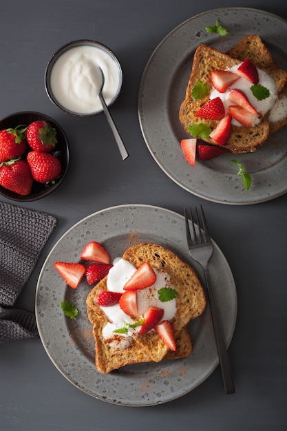 French toasts with yogurt and strawberries for breakfast