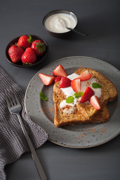 French toasts with yogurt and strawberries for breakfast