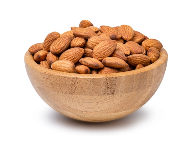 Fresh almonds nut in wooden bowl.