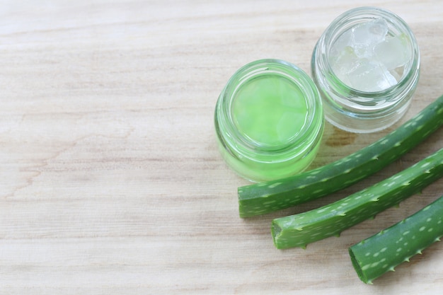 Fresh aloe vera and jelly in Glass bottle placed 