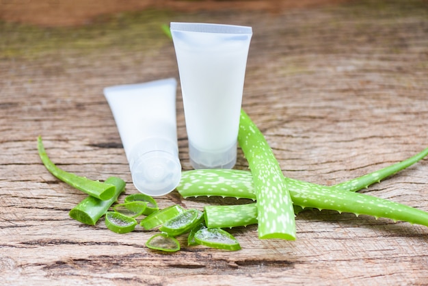 Fresh aloe vera plant leaf with gel on wooden natural herbs and herbal medicines cosmetic cream