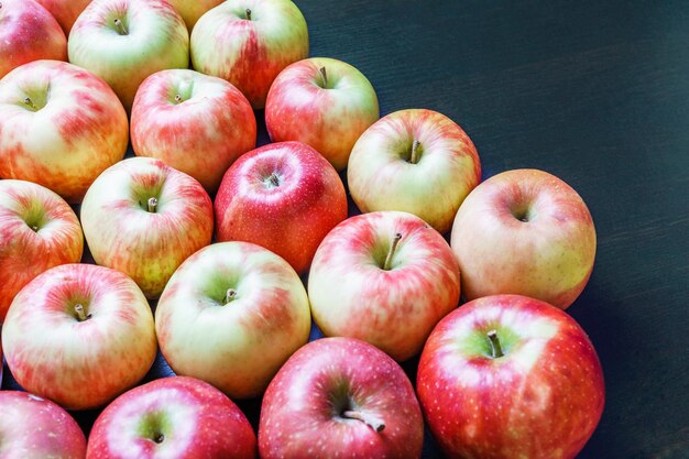 Fresh apples on a dark wooden background