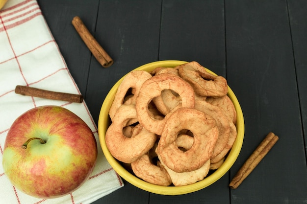 Fresh apples and dried apples on the table