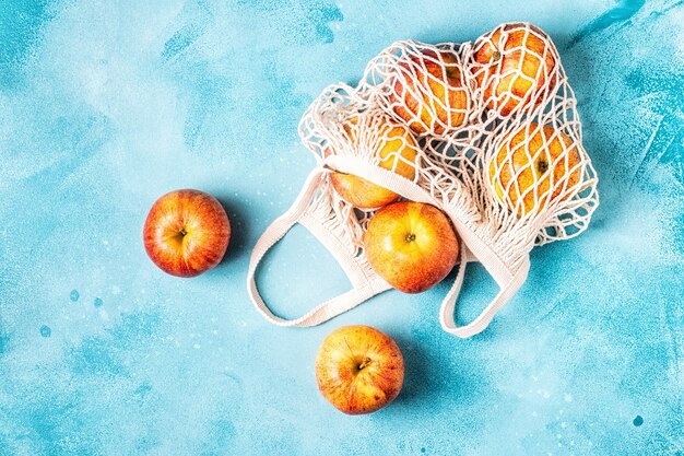 Fresh apples in a mesh bag