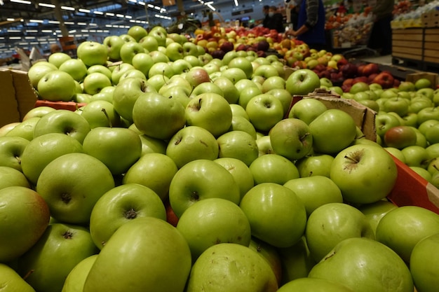 Fresh apples sold in the supermarket Fruit market Close up for background