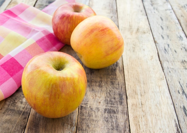 Fresh apples on wooden background