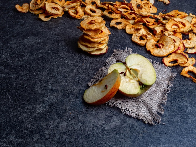 Fresh applewith pieces of dry in dehydrator slices of yellow and red apples healthy snack