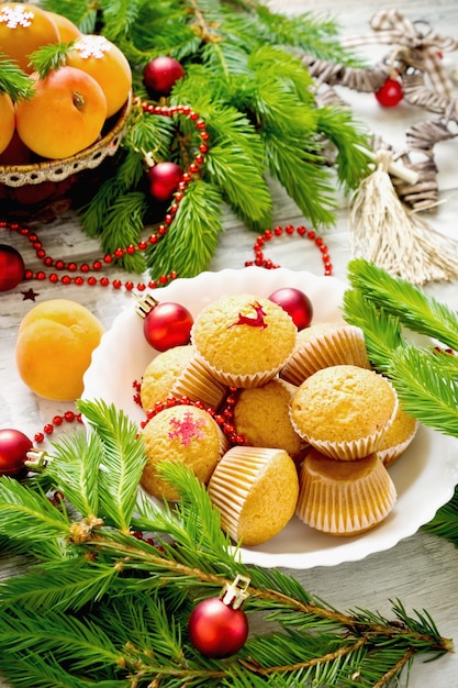 fresh apricots and christmas decorations on the table