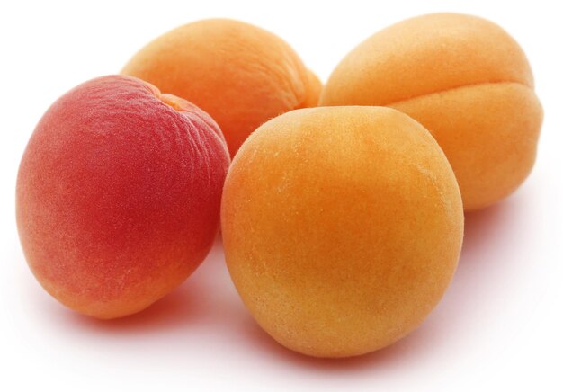 Fresh apricots over white background