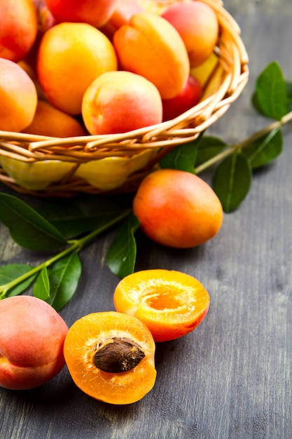 fresh apricots with leaf on white