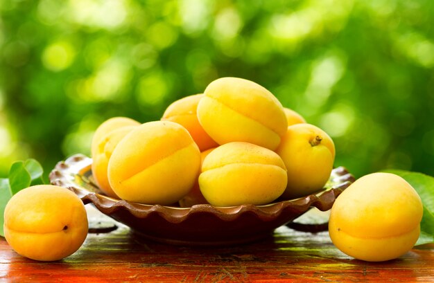 Fresh apricots on wooden table