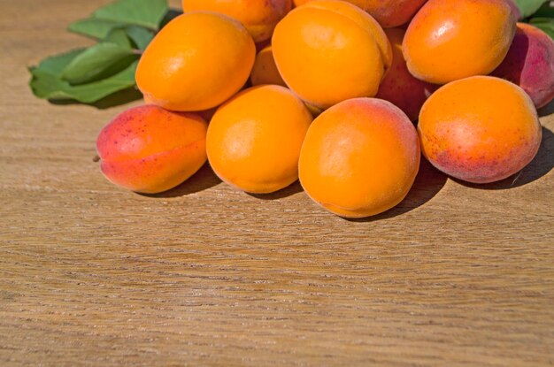 Fresh apricots on a wooden table