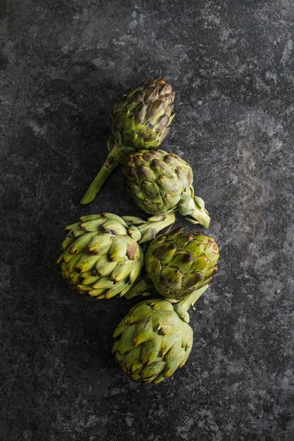 Fresh Artichoke on black background Raw Artichok closeup