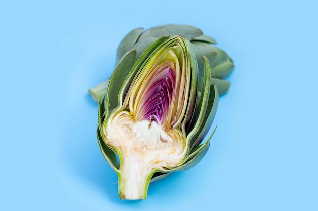 Fresh artichoke on blue background