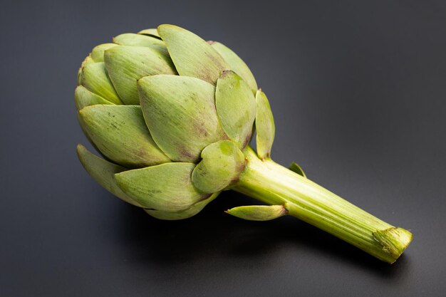 Fresh artichoke on dark background