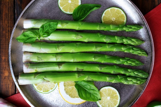 Fresh asparagus on pan closeup