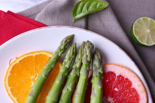 Fresh asparagus on plate closeup