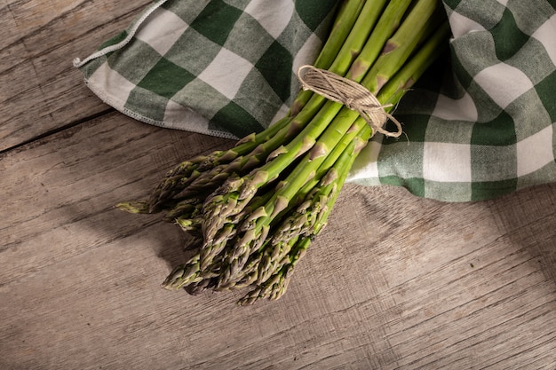 Fresh asparagus on wood