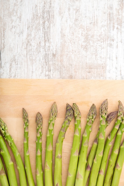 Fresh Asparagus on a wooden tablet.